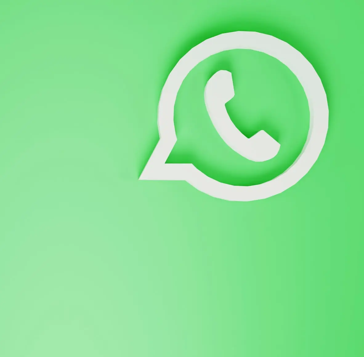 a green wall with a white phone on it